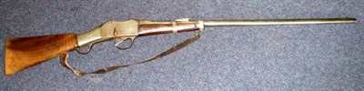 Lot 517 - A 19th Century Martini Henry .577/.450 Rifle, the 71cm steel barrel with hinged ladder sight,...