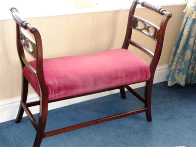 Lot 1456 - A Regency Style Mahogany Double Stool, upholstered in red velvet, the turned top rail with...