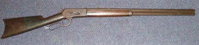 Lot 533 - A Winchester Model 1886 40-82 W.C.F. Rifle, the 65cm octagonal steel barrel stamped with...