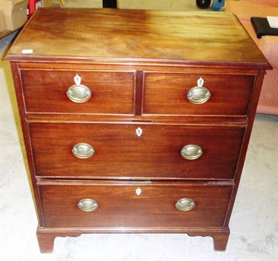 Lot 1460 - A George III Mahogany Straight Front Chest, of two short and two long drawers, with ivory...