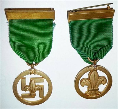 Lot 38 - Two Boy Scout Medals of Merit, awarded to Clifford Cookson, 13.2.35, the first centred by a...