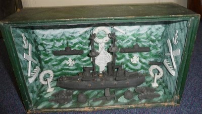 Lot 95 - A First World War German Diorama, of a gunboat with tanks, biplanes, mines, crossed oars, iron...