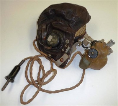 Lot 123 - A Second World War RAF Leather Flying Helmet, C Type, the bakelite earphones marked AM centred by a