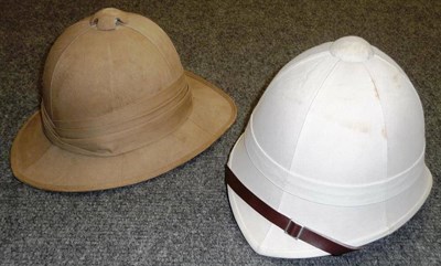 Lot 124 - A Khaki Pith Helmet, with triple pleat puggaree, leather sweatband, silver foil and green baize...