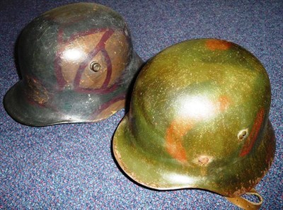 Lot 132 - A German M35 Army Helmet, with camouflage paint, folded rim, stamped 715, with leather liner...