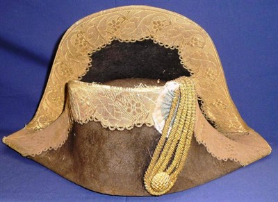 Lot 135 - An Early 19th Century French Black Silk Bicorn Hat, with bullion thread rosette and button and gold