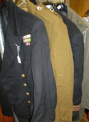 Lot 137 - Uniforms, comprising:-two Merchant Navy Officer's tunics, one with Second World War medal...