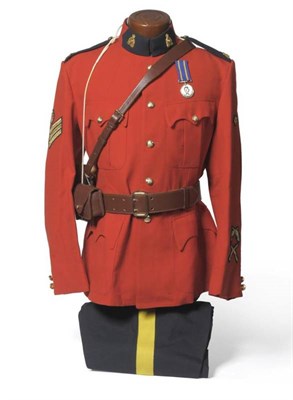 Lot 140 - A Modern Royal Canadian Mounted Police Uniform, circa 1980/81, comprising a red tunic, the blue...