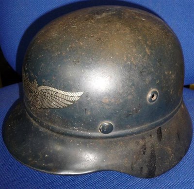 Lot 148 - A German Third Reich Luftschutz Beaded M40 Helmet, with silver decal, folded rim, the inner rim...