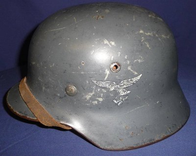 Lot 154 - A German Third Reich Luftwaffe M35 Double Decal Helmet, with smooth blue/grey paint, folded...