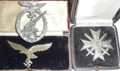 Lot 155 - A German Third Reich War Merit Cross with Swords, First Class, with sword shape pin, in case of...