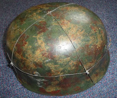 Lot 160 - A Copy of a German Third Reich M38 Paratrooper's Helmet, with camouflage paint, eagle and...