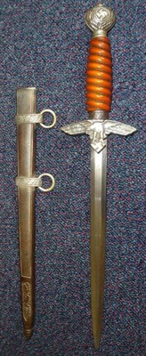 Lot 173 - A German Third Reich Luftwaffe Dagger, Second Model, the heavily pitted double edge steel blade...