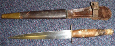 Lot 197 - A Second World War Commando Fighting Knife, third pattern, with machine forged steel blade,...