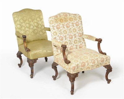 Lot 1488 - A Walnut Framed Library Armchair, early 20th century, upholstered in green floral silk damask, with