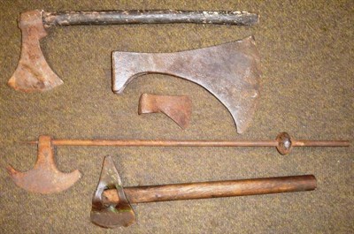 Lot 281 - An Indian Axe, with crescent shape blade and knopped spiked haft, two other axes with wood...