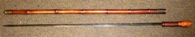 Lot 282 - A Georgian Bamboo Sword Cane, with 74cm triangular section fullered steel blade, the root-end...