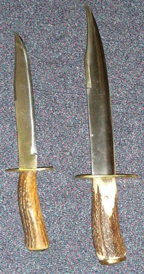 Lot 288 - Two Modern Hunting Knives, each with clip-point steel blade with fine serrated edge, brass...