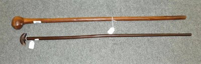 Lot 303 - A Zulu Knobkerrie, the offset ";golf wood"; type head with recess to the top and underside, on...