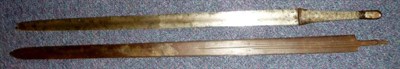 Lot 314 - A Sudanese Sword, the 74cm double edge steel blade with a shallow fuller to each side, the wood...