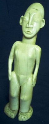 Lot 338 - An Early to Mid 20th Century Kenyan Ivory Figure, of a woman, standing with her hands resting...