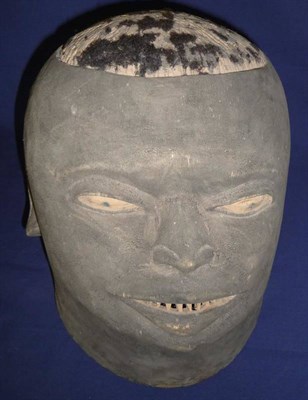 Lot 358 - A Cameroon Ebonised Softwood Helmet Mask/Voice Disguiser,  the rounded skull inset with tufts...