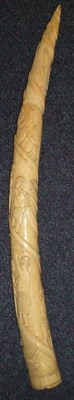 Lot 360 - An Early 20th Century Loango Ivory Tusk, carved with a spiral of workmen, tradesmen, crocodile,...