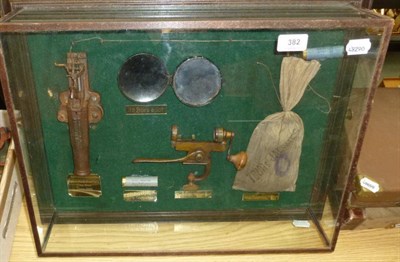 Lot 382 - A ";Poacher's"; Display, with a French made poacher's trap gun with trip wire, two 16 bore...