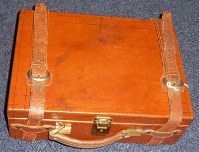 Lot 403 - A Modern Tan Leather Cartridge Case, with tooled decoration, the green velour lined interior fitted