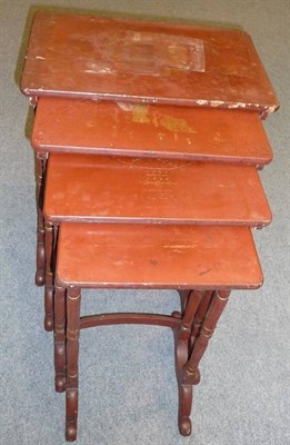 Lot 1501 - A Set of Four 19th Century Chinese Export Nesting Tables, in red lacquer with gilt decoration,...