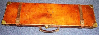 Lot 405 - A Brass Bound Stitched Leather Shotgun Case, the crimson baize lined case fitted to take 30inch...