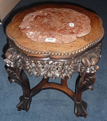 Lot 1503 - A Chinese Marble and Padouk Wood Plant Stand, circa 1900, the mottled pink and white marble above a