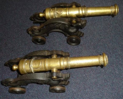 Lot 484 - A Pair of Brass and Cast Iron Model Cannons, each with a 34cm ringed brass barrel with ringed...