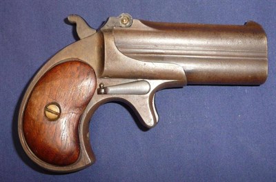 Lot 505 - A Remington Over and Under Double Barrel Derringer, the 7.5cm barrels hinged at the top,...