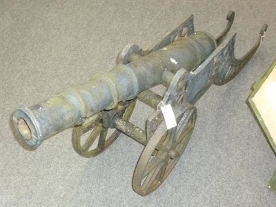 Lot 521 - A Victorian Black Painted Cast Iron Model of a Cannon, with 92cm triple ring barrel,...