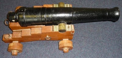 Lot 523 - A Black Painted Cast Iron Model of a Signal Cannon, non-working, the 61cm triple banded...