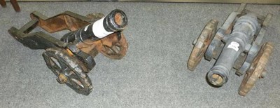 Lot 530 - A Pair of Black Painted Cast Iron Model Cannons, each with 45cm ringed barrel cast with a...