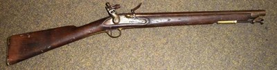 Lot 545 - A 19th Century Indian Flintlock Carbine, with 47cm steel barrel, wood full stock with brass...