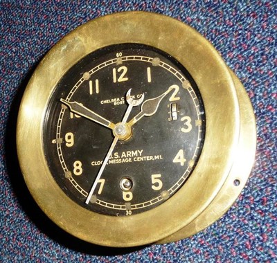 Lot 51 - A US Army M1. Message Center Clock, the 10cm circular black enamel dial with luminous hands, centre