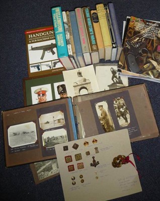 Lot 58 - A Small Quantity of Militaria, including a card display of rank and cap badges, books,...