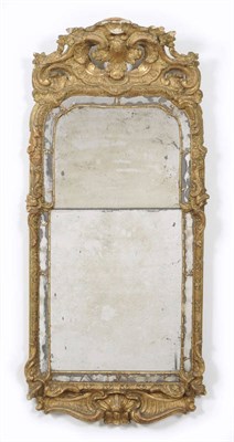 Lot 1523 - A Regence Giltwood and Verre Eglomise Mirror, early 18th century, the original mercury plates...