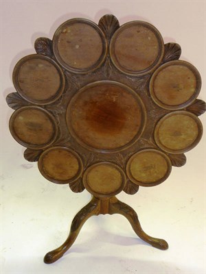 Lot 1525 - A Mahogany Tripod Supper Table, 19th century, the carved top comprising nine circular moulded plate