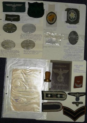 Lot 113 - A Collection of German Third Reich Cloth Insignia and Militaria, including six aluminium dog...