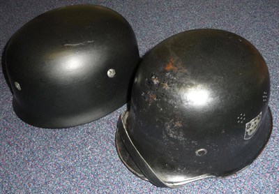 Lot 115 - A German Third Reich M1938 Paratrooper's Helmet, with black paint, slotted bolts, folded rim, inner