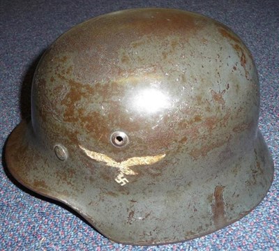 Lot 116 - A German Third Reich Luftwaffe M35 Double Decal Helmet, with smooth dark grey paint, folded...