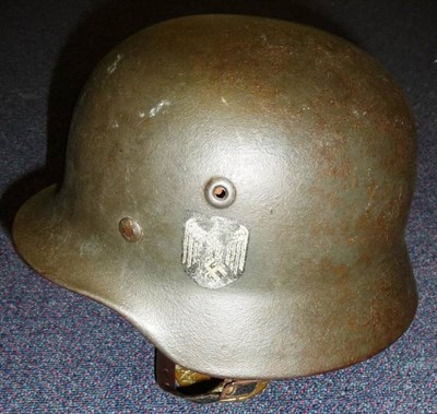 Lot 127 - A German Third Reich M35 Army Helmet, with single Heer eagle and swastika decal, one decal removed