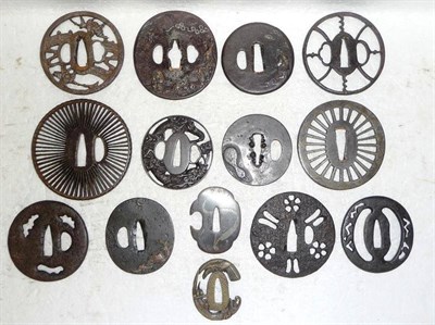 Lot 135 - A Group of  Fourteen Japanese Tsuba, 17th-19th Century, comprising twelve iron examples, some...