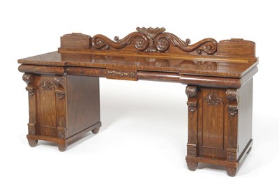 Lot 1530 - A William IV Mahogany Breakfront Pedestal Sideboard, the gallery back centred by carved...