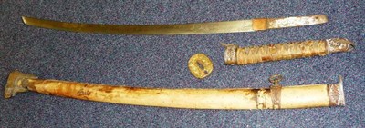 Lot 139 - A Second World War Japanese Katana, the 71cm steel blade bearing traces of etched decoration at the