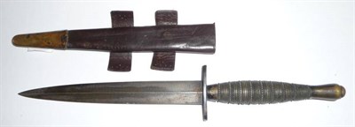 Lot 170 - A Second Pattern Commando/Fighting Knife, with machine forged steel blade, the brass rings and bead